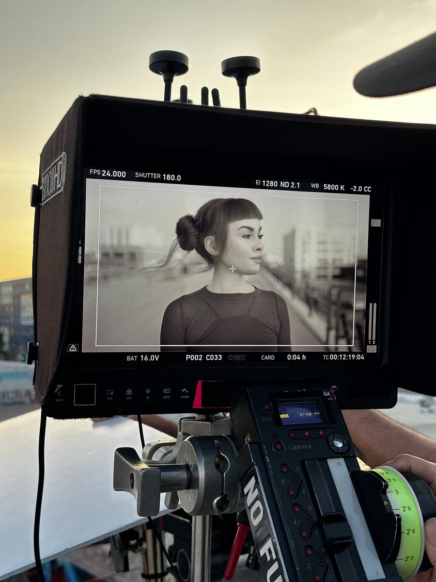 Camera monitor showing Miquela in black and white